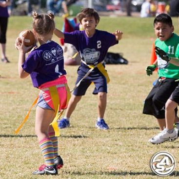 Girl throwing football